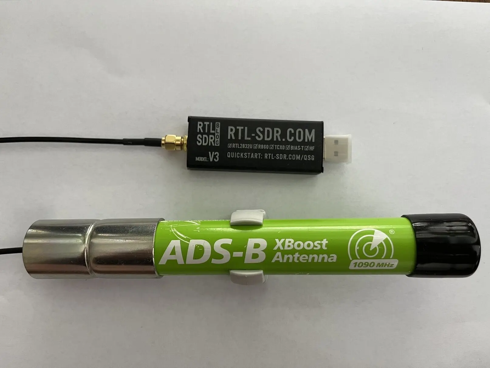 RTL-SDR dongle and antenna for receiving ADS-B messages.